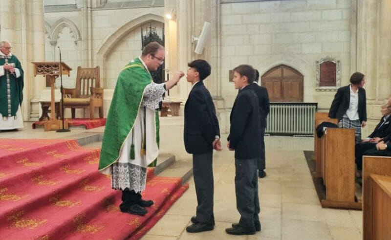 On Sunday 18th June 2023, five Downside School pupils - Oliver, Ryan, Johnny, Ottilie, Akaniro - received Holy Communion for the first time during Mass in the Abbey Church.