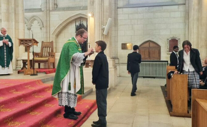 On Sunday 18th June 2023, five Downside School pupils - Oliver, Ryan, Johnny, Ottilie, Akaniro - received Holy Communion for the first time during Mass in the Abbey Church.